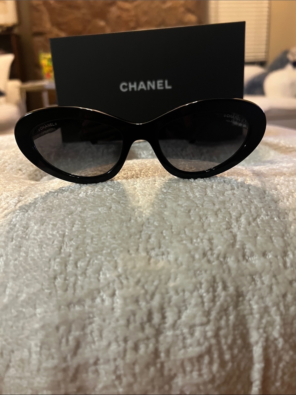 CHANEL Black Cat-Eye Sunglasses with Gold Chain Accent